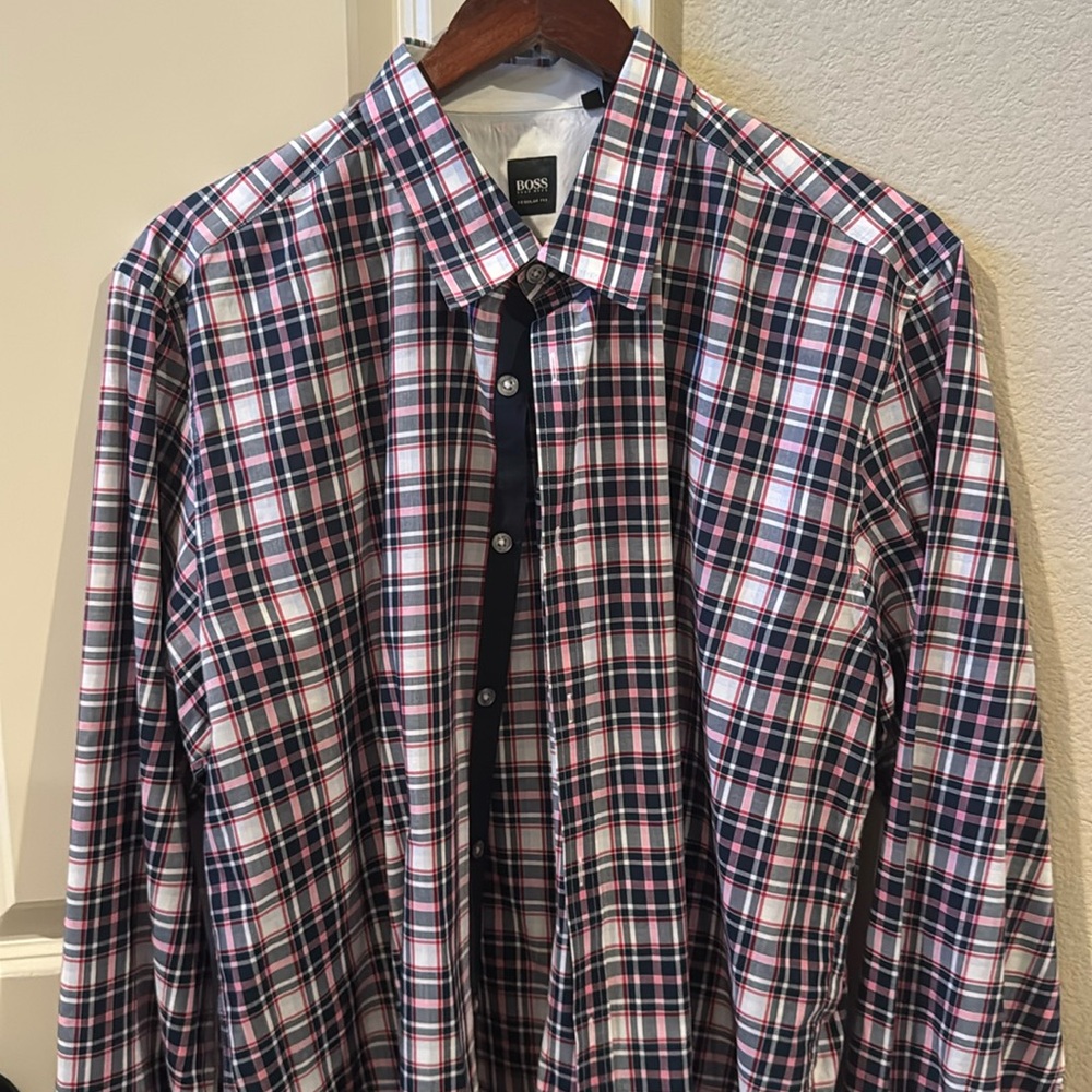 Plaid button down shirt.